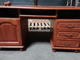 a wooden desk with drawers and drawers on it
