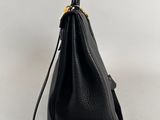 a black leather handbag on a white background