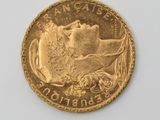 an image of a gold coin on a white surface