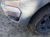 a close up of the front of a truck with mud all over it