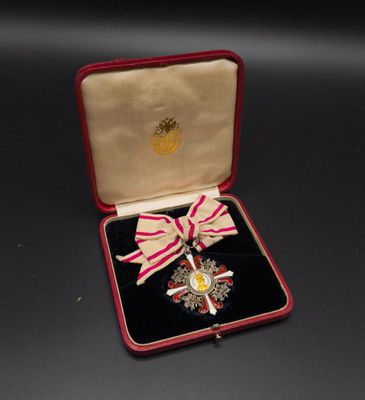 an image of a medal in a case with a ribbon around it