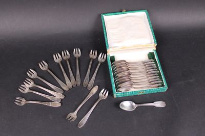 a lot of forks and spoons in a green box