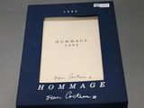 an image of a picture frame with the words hommage written on it