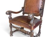 an image of a chair with a leather seat and wood frame