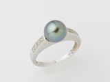 a black pearl and diamond ring on a white background