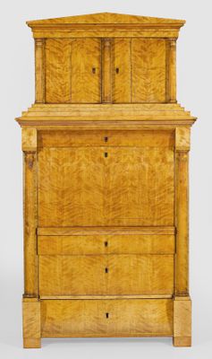 a wooden chest of drawers with three drawers on top of it