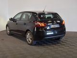 a picture of a black car parked in a showroom