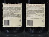 six bottles of wine are lined up on a table