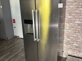 an image of a stainless steel refrigerator in a kitchen