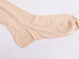 an image of a pair of socks laying on top of a white surface