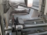 an image of a machine that is working on a piece of metal