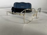 the glasses are on the table next to the case