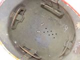a close up of a helmet with holes in it