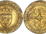 a gold coin with a shield on the front and a shield on the back