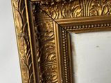an image of a gold frame with a decorative pattern on it