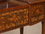a wooden table with two drawers and a clock on it