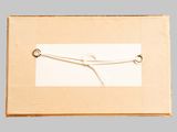 a picture of a box with a string tied to it