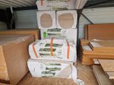 several stacks of cardboard boxes stacked on top of each other in a garage
