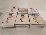 six paperbacks of a woman in high heels are stacked on top of each other