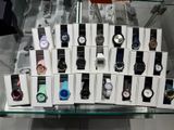 a lot of watches on display in a glass case