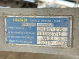 a label on the side of a machine that is sitting on a table