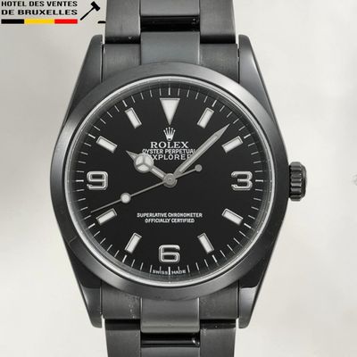 a close up of a wrist watch with a black dial