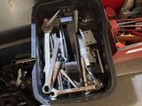 many tools in a tool box on the floor