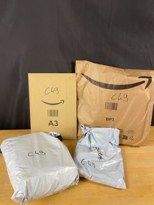 two bags of food sitting on a table next to a bag of food