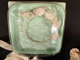 a picture of a glass box with a bracelet on it