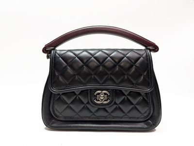 chanel black quilted leather handbag with wooden handle