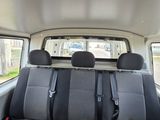 the back seats of a van with black and gray seats in the back of it