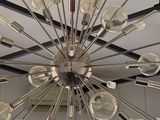 a chandelier that has a lot of light bulbs on it