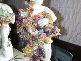 two figurines that are sitting on a table