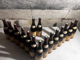 several bottles of wine are arranged in a heart shape on a table