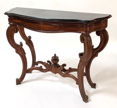 an image of a wooden table with a black marble top