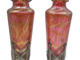 two vases sitting side by side on a white background