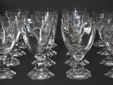 a lot of wine glasses sitting on a table