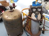 two propane gas cylinders sitting on a table