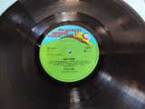 vinyl record with a label on it sitting on a table