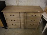 an image of a dresser with drawers and a chair in a room