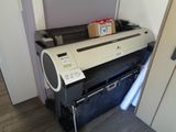 a printer that is sitting on top of a cabinet