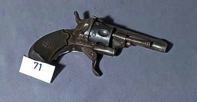 an old gun with a tag on the side of it