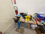 a workbench with tools on it in a room