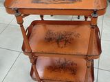 a small wooden table with a tray on top of it