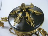 a black and gold box with gold decorations on it