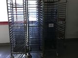 many trays of food on the cart in the room
