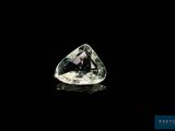 a green and white diamond on a black background