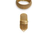 an assortment of gold jewelry including a bracelet, ring, and bracelet