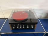 a record player sitting on top of a glass table