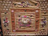 an image of a decorative piece of cloth with a bear on it